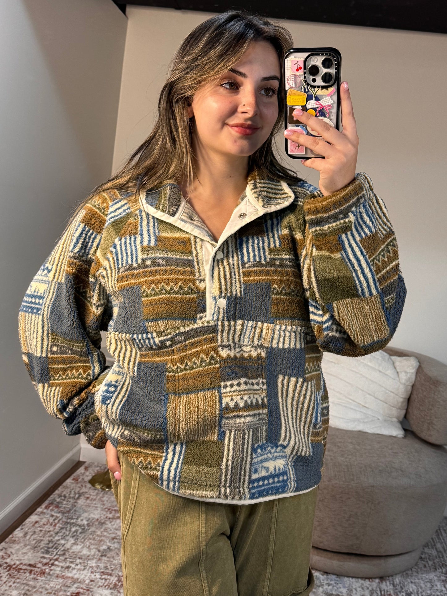 Person wearing a patterned jacket in an indoor setting