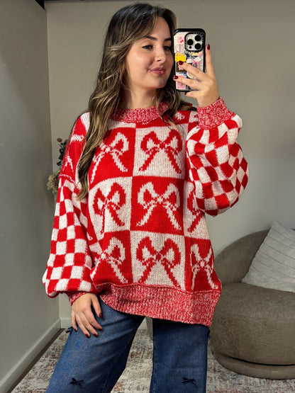 red and white patterned bow checker oversized christmas sweater 