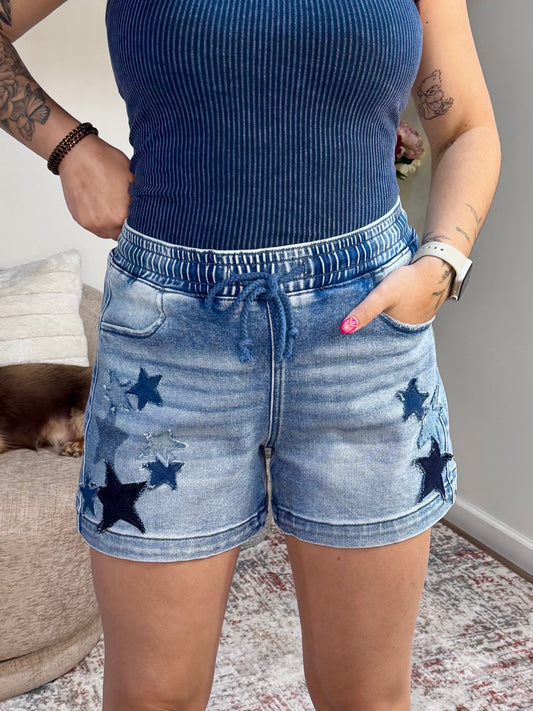 Slouchy denim shorts with star patch details and elastic drawstring waist