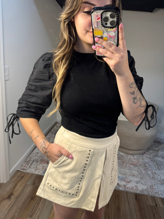 cream suede studded skort with pockets black puff sleeve top