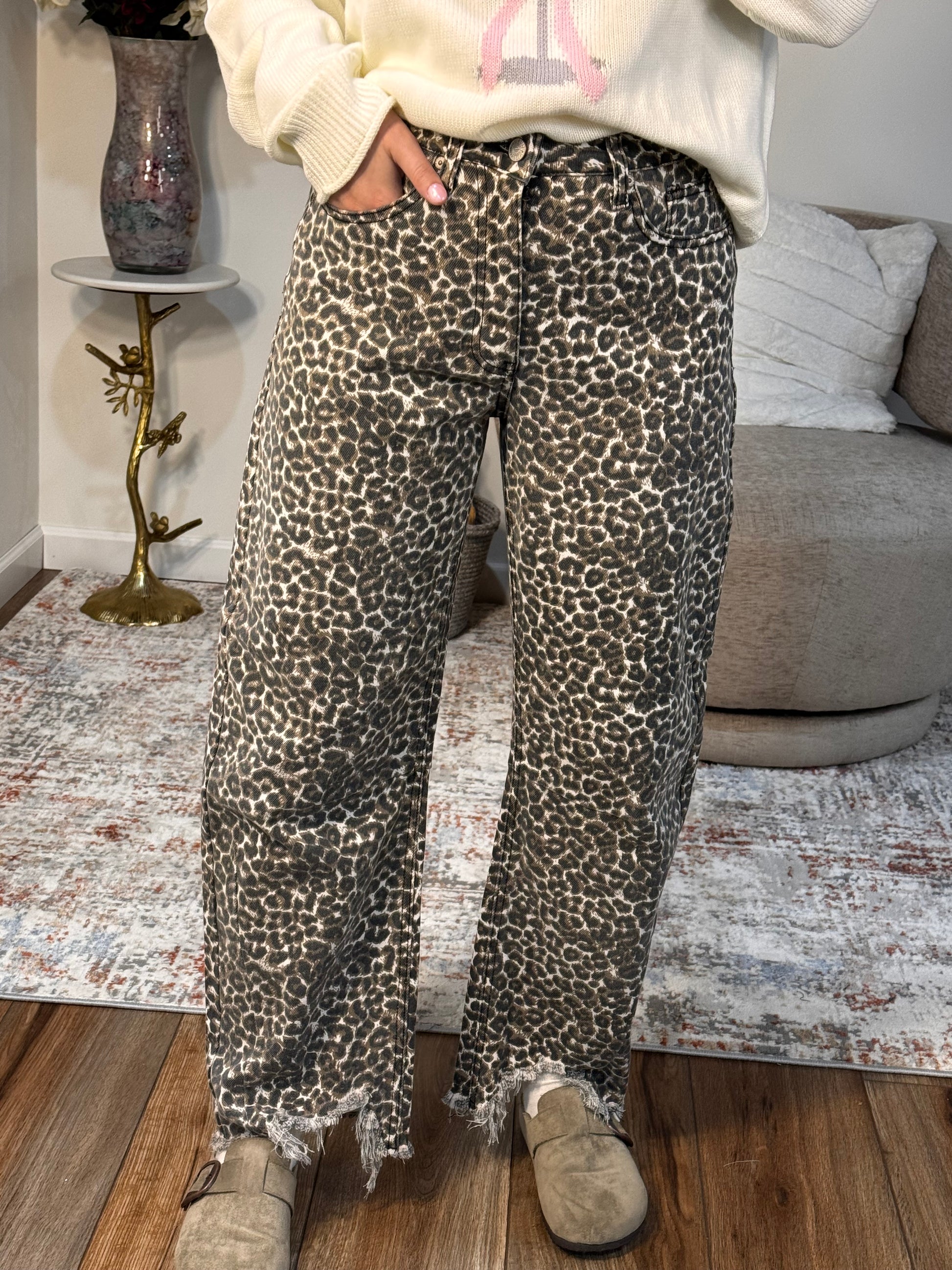 Person wearing leopard print pants l