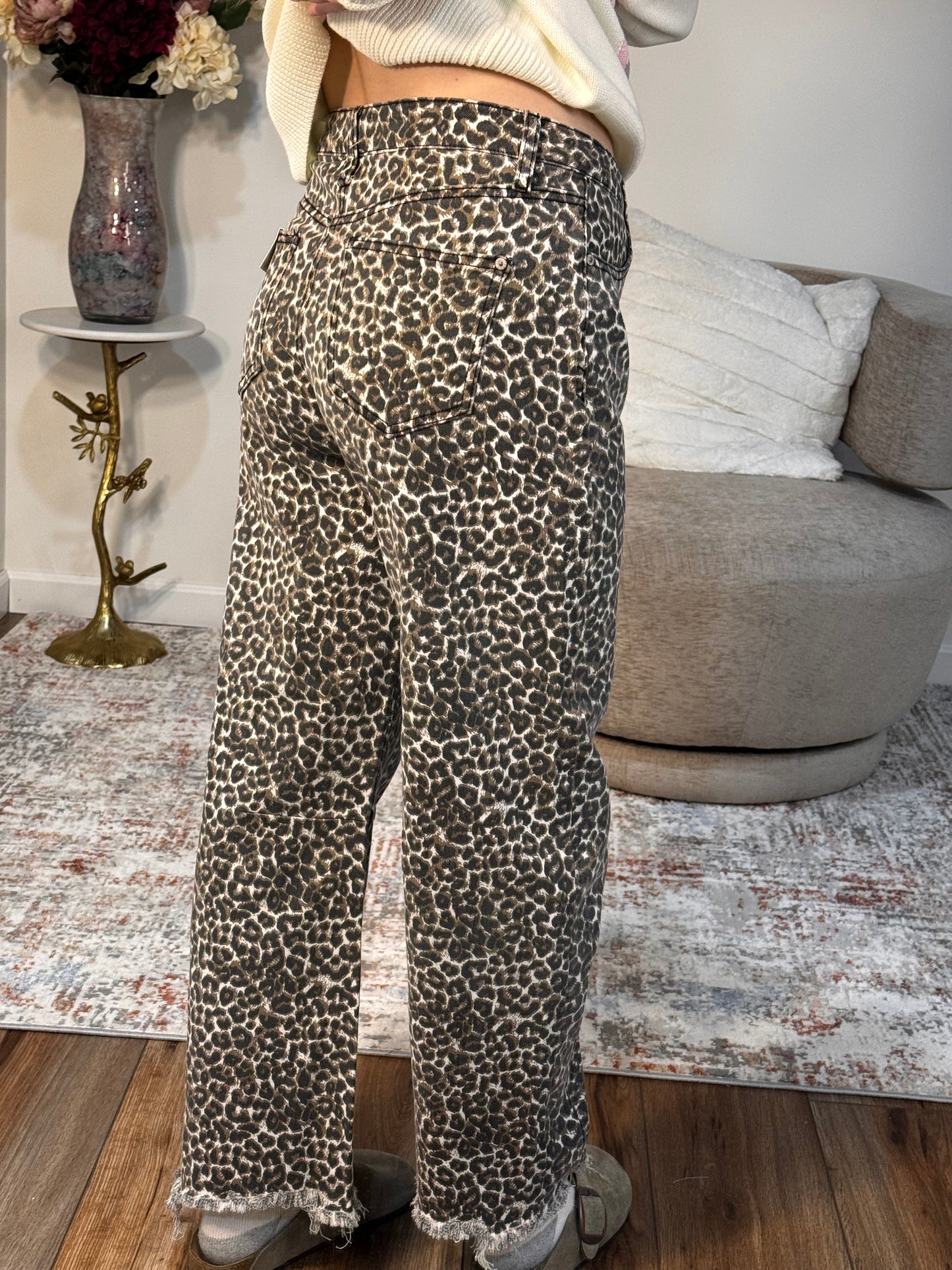 Person wearing leopard print pants 