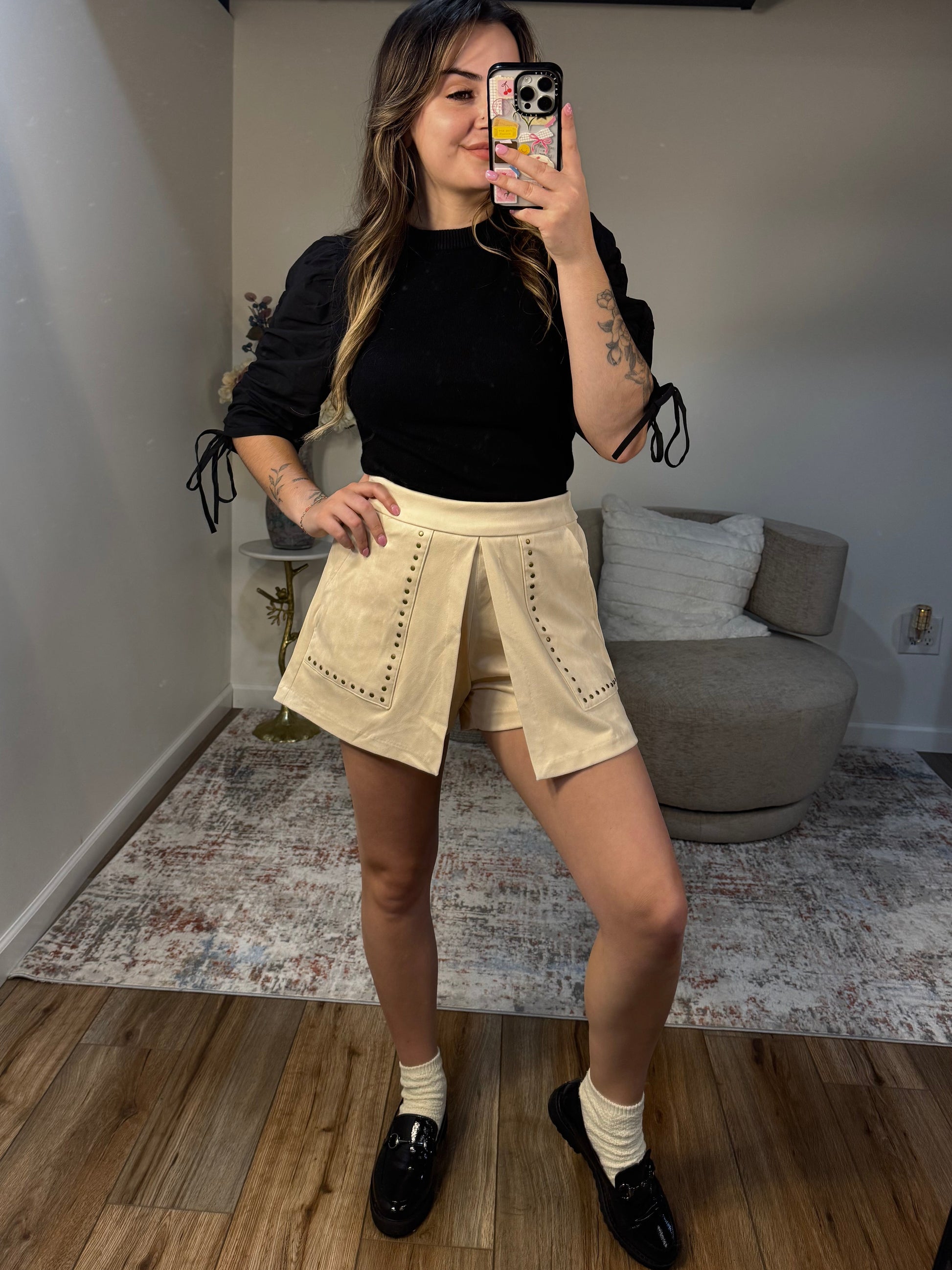 cream suede studded skort with pockets black puff sleeve top