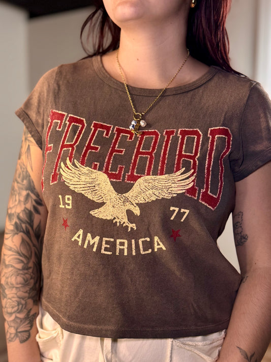 Espresso cropped tee with 'Free Bird' graphic and eagle design.
